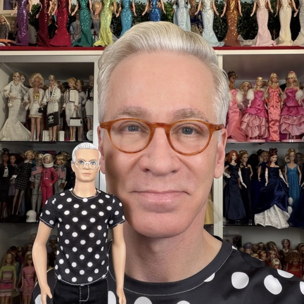 Matthew Keith, founder of Dolls on the Brain, in front of his doll collection